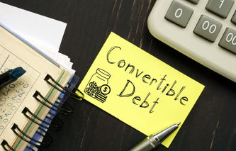 Induced Conversions of Convertible Debt